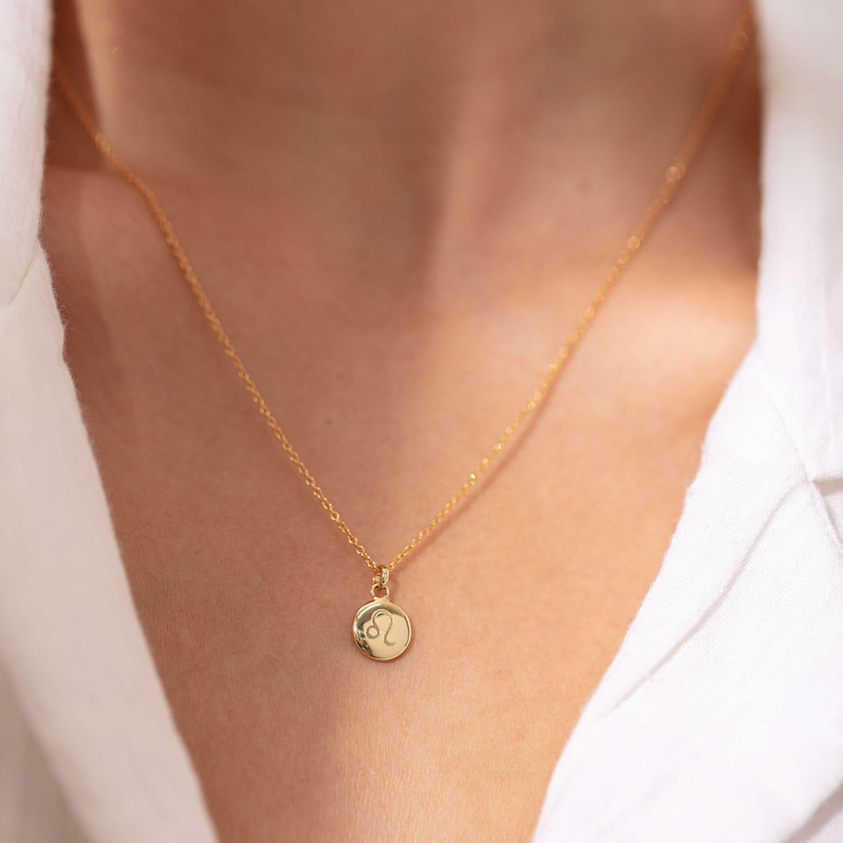 Model wearing Zodiac pendant
