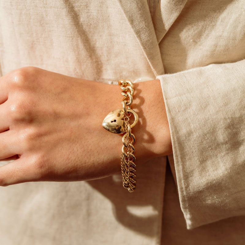 Deja Vu 9ct Gold Solid Curb Bracelet with Puff Heart Padlock