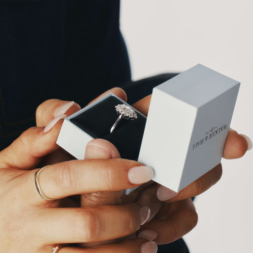 Woman being proposed to with a Walker & Hall Ring Box