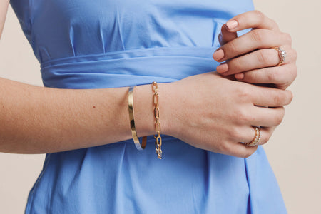 Model wearing yellow gold and diamond jewellery